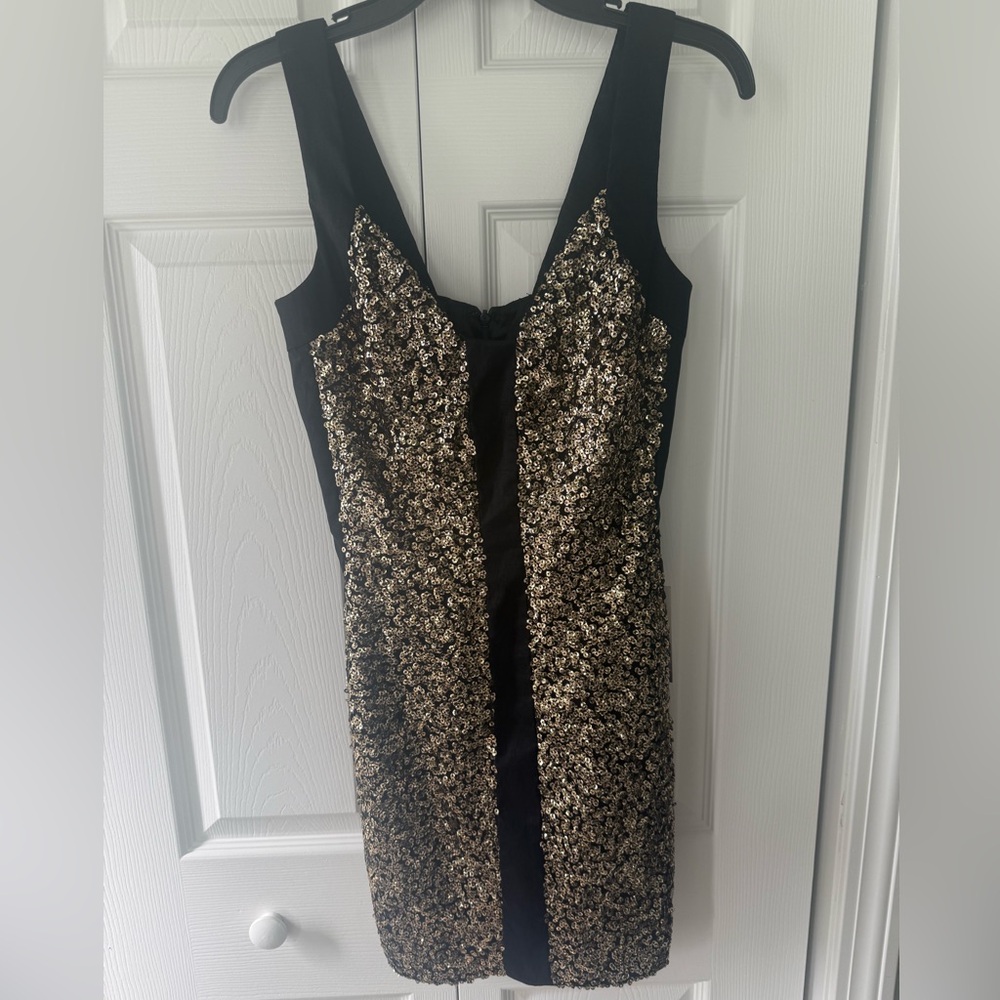 Jessica McClintock black and gold fitted mini.